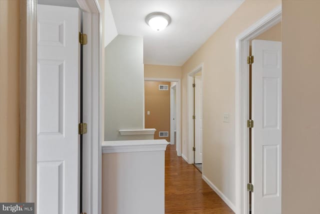 hallway featuring hardwood / wood-style floors