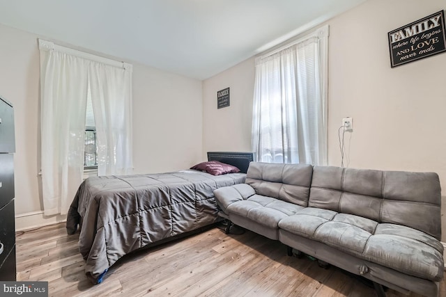 bedroom with light wood-type flooring