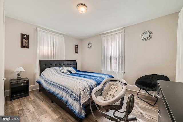 bedroom with wood-type flooring