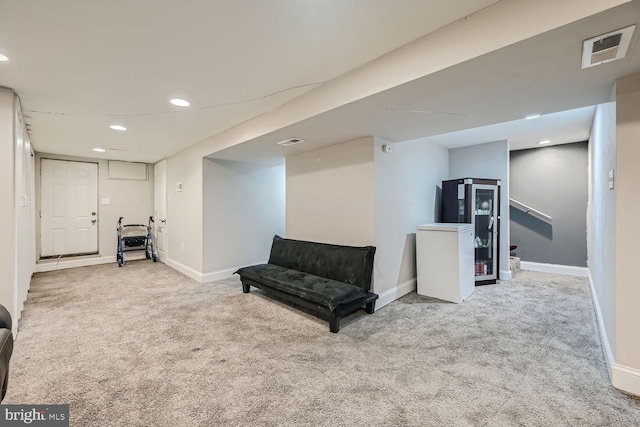 living area with light carpet