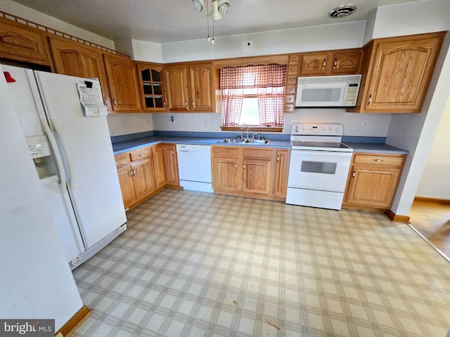 kitchen with white appliances and sink