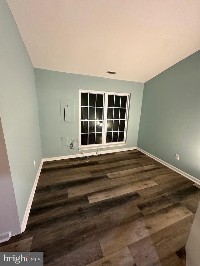 empty room featuring dark hardwood / wood-style floors