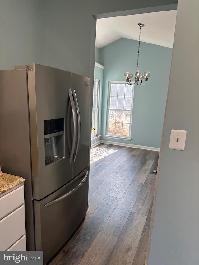 986 Yachtsman Way, Annapolis, MD 21403 - kitchen featuring stainless steel refrigerator with ice dispenser, dark wood-type flooring, a chandelier, white cabinets, and high vaulted ceiling