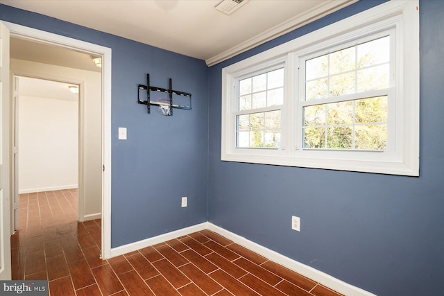 empty room with dark hardwood / wood-style flooring