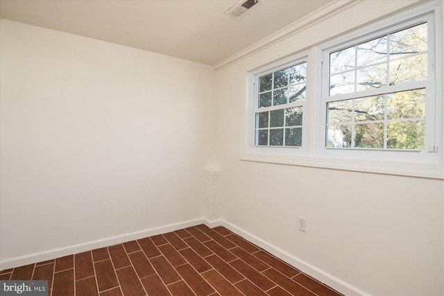 spare room featuring dark wood-type flooring