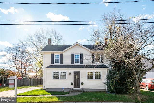 traditional home featuring a chimney