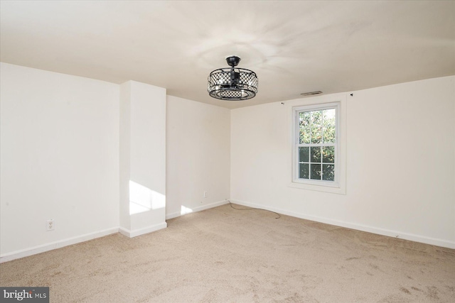 unfurnished room with light carpet