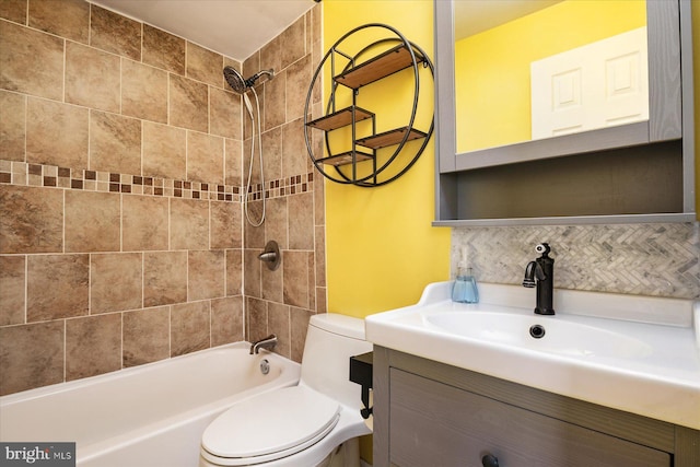 full bath featuring toilet, decorative backsplash, vanity, and shower / bath combination