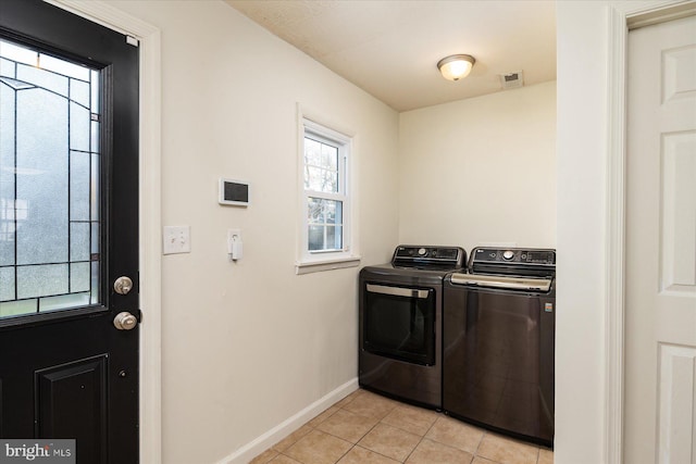 washroom with light tile patterned flooring and independent washer and dryer