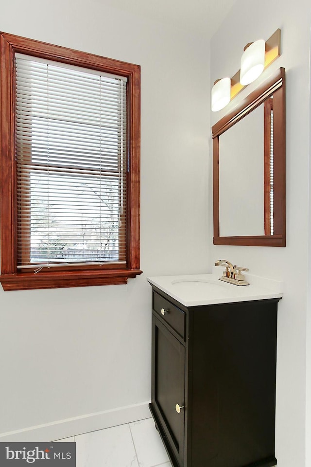 bathroom with tile patterned floors and vanity