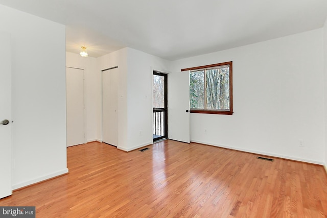 empty room with light wood-type flooring