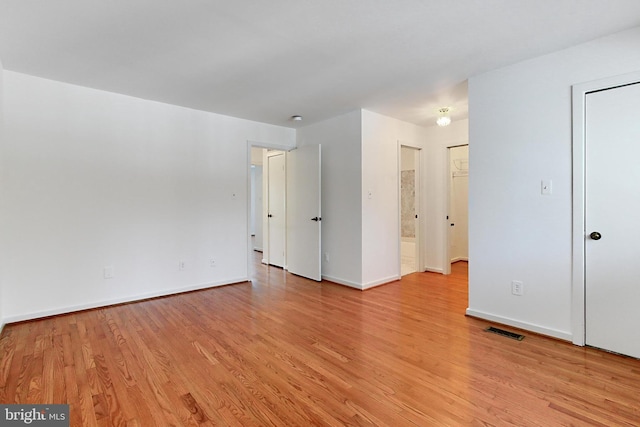 unfurnished room with light hardwood / wood-style flooring