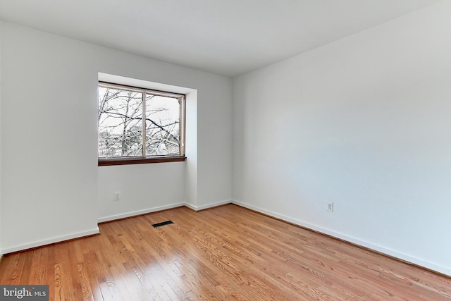 empty room featuring light hardwood / wood-style floors