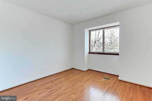 empty room with light wood-type flooring