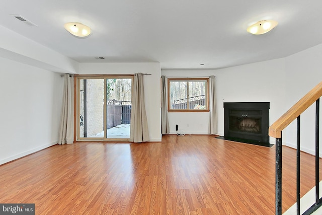 unfurnished living room featuring hardwood / wood-style floors