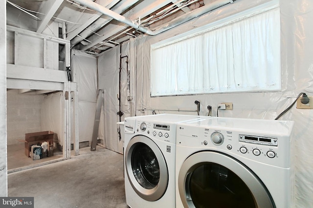 laundry area featuring washing machine and clothes dryer