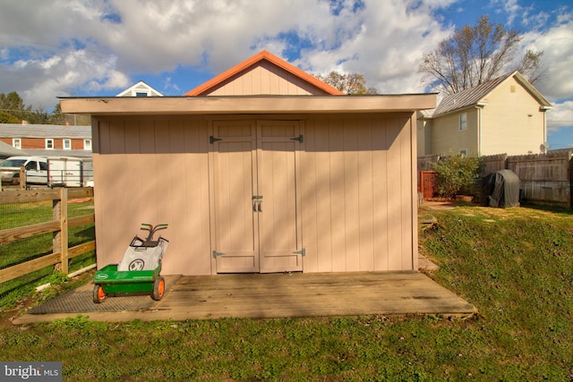 view of outdoor structure featuring a lawn