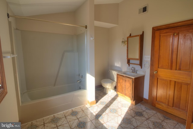 full bathroom featuring lofted ceiling, toilet, tile patterned flooring, washtub / shower combination, and vanity