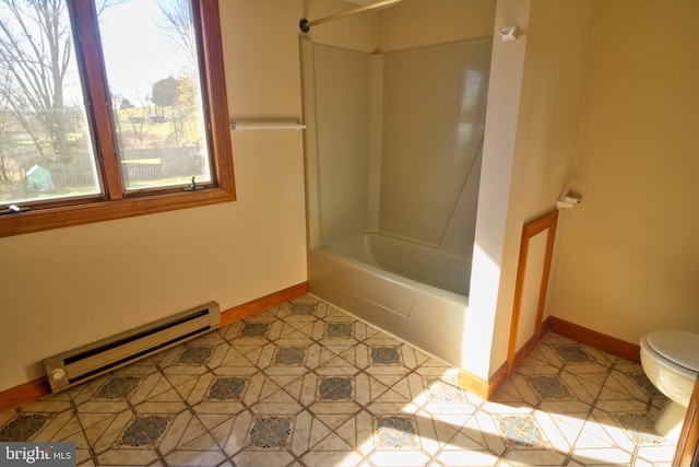 bathroom with tile patterned flooring, tub / shower combination, toilet, and a baseboard heating unit