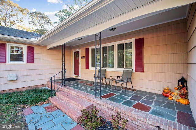 doorway to property featuring a porch