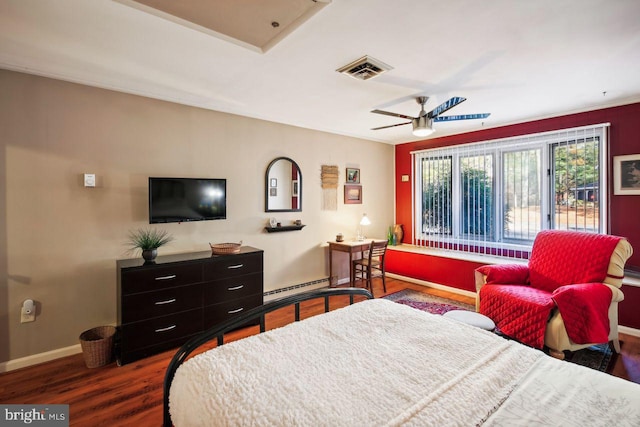 bedroom featuring a baseboard heating unit, dark hardwood / wood-style flooring, and ceiling fan