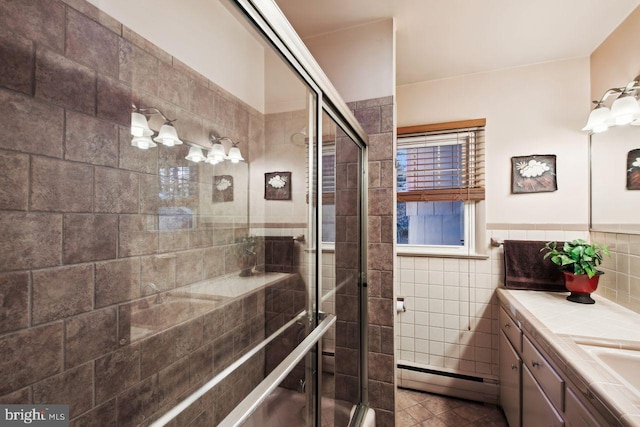 bathroom with walk in shower, baseboard heating, vanity, and tile walls