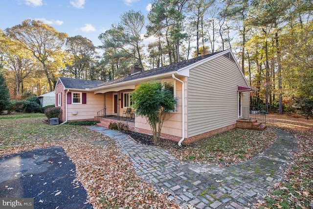 8388 Hilda Dr, Salisbury, MD 21804 - view of front facade featuring a porch and a chimney