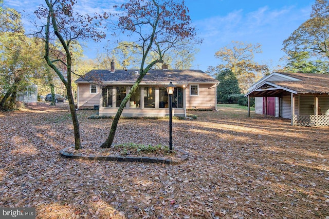 view of front of home with a sunroom