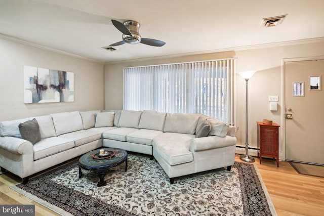 living room with ornamental molding, a baseboard radiator, wood-type flooring, and ceiling fan