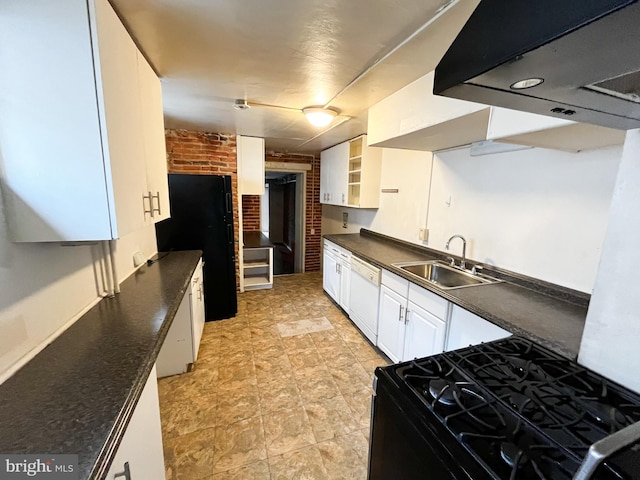 kitchen featuring white cabinets, sink, black appliances, and brick wall