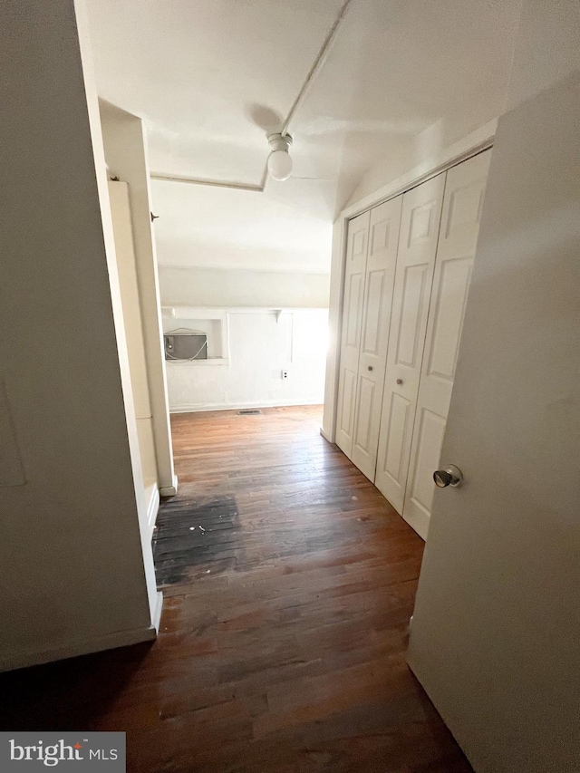 corridor with dark wood-type flooring