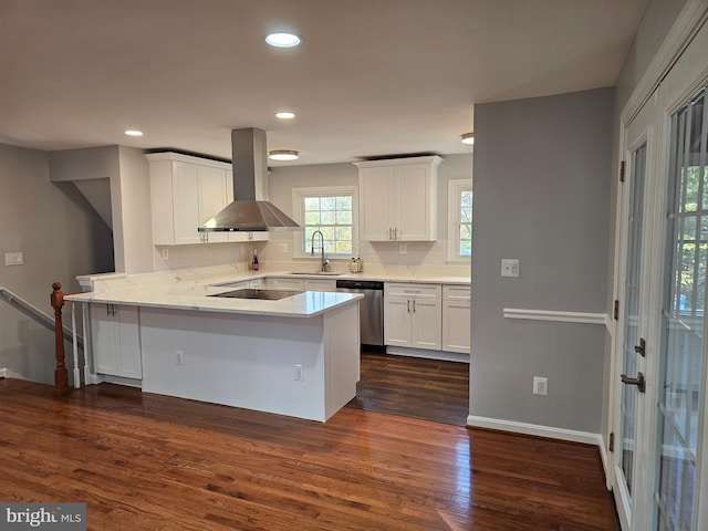 kitchen with kitchen peninsula, dark hardwood / wood-style flooring, stainless steel dishwasher, extractor fan, and white cabinetry