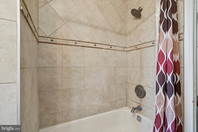 bathroom with shower / tub combo with curtain