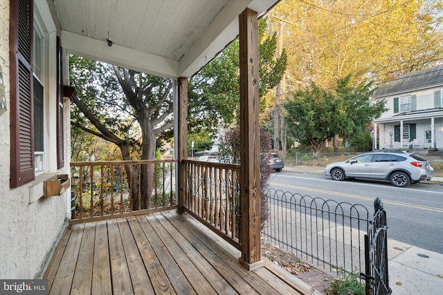 wooden deck featuring covered porch