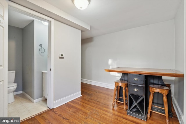 bar featuring hardwood / wood-style floors