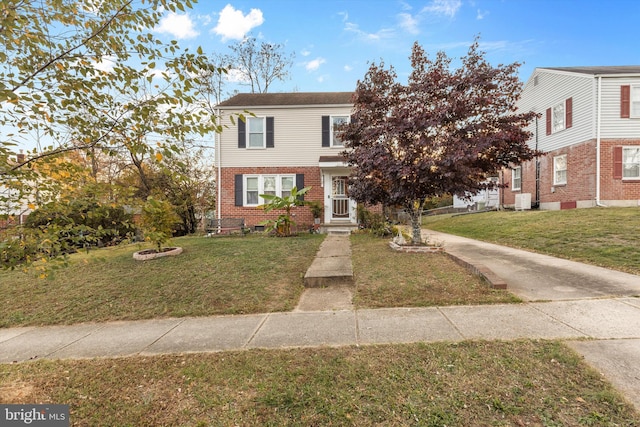 view of property featuring a front yard