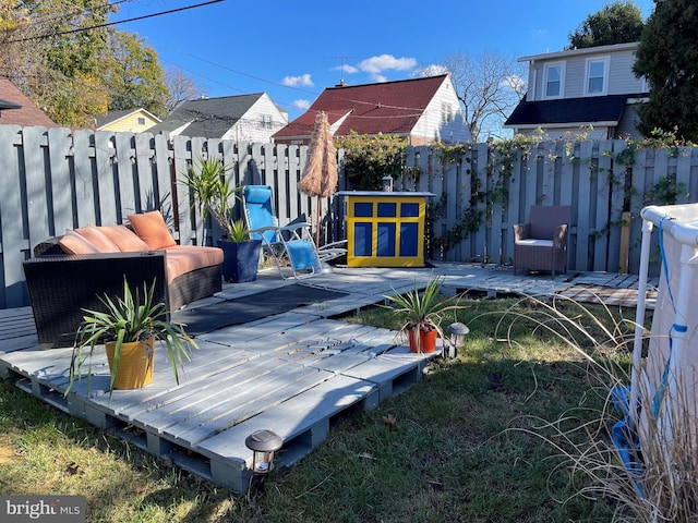 wooden deck featuring outdoor lounge area