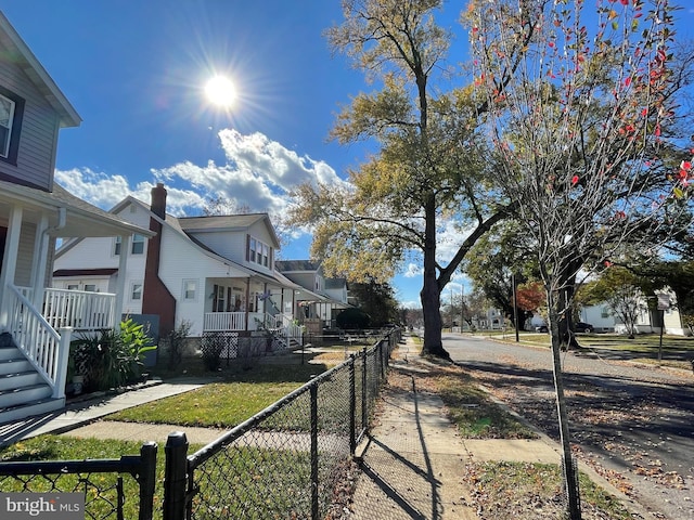 view of side of property with a porch