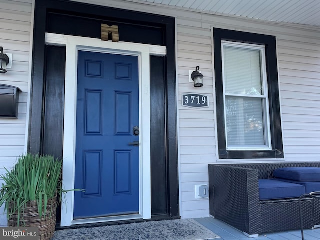 doorway to property with a porch