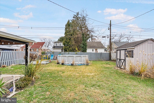 view of yard with a fenced in pool