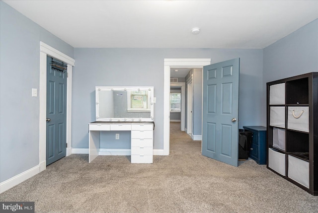 unfurnished bedroom with light carpet