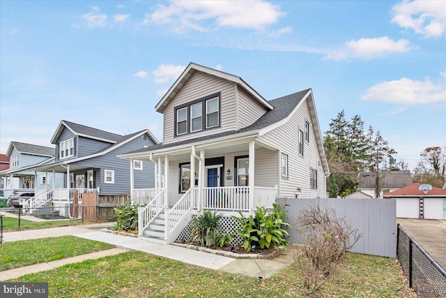 view of front of house featuring a porch and a front yard