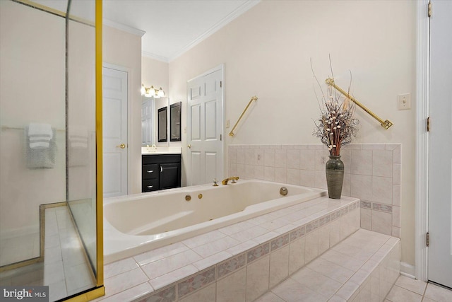 bathroom featuring vanity, tile patterned floors, crown molding, and tiled tub