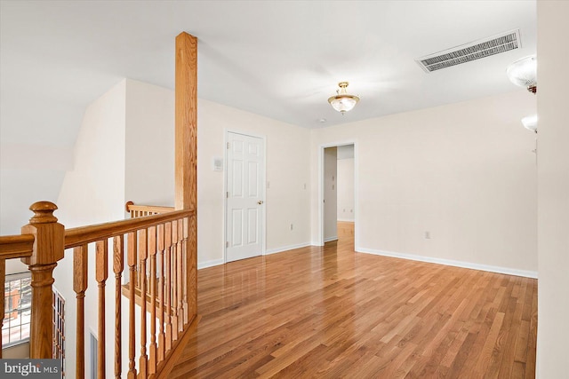 spare room featuring light hardwood / wood-style flooring