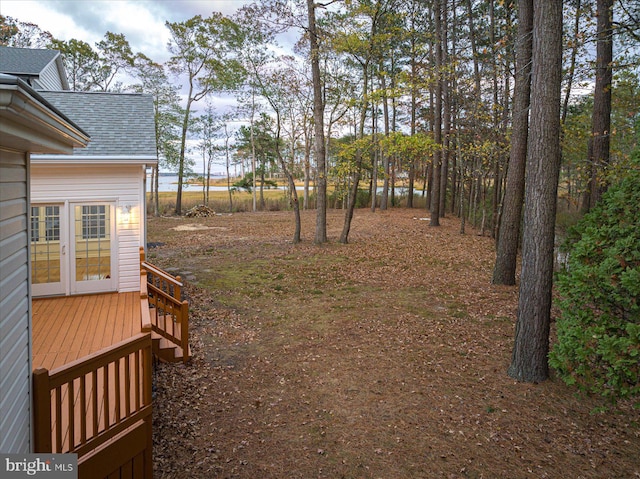 view of yard with a wooden deck