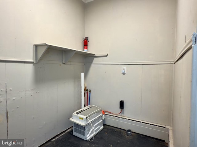 laundry area with hookup for a washing machine and a baseboard radiator