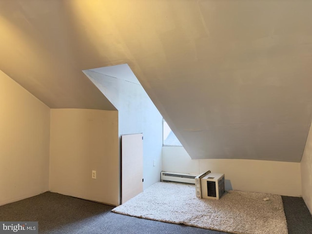 additional living space with carpet, lofted ceiling, and a baseboard heating unit