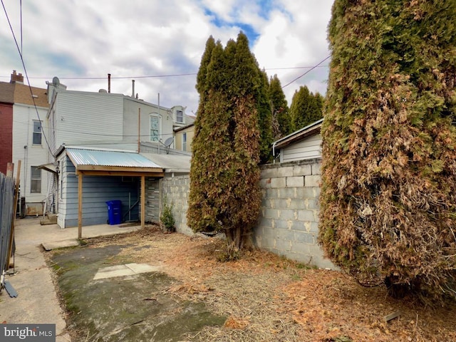 view of property exterior featuring a patio