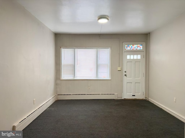 carpeted foyer entrance featuring a baseboard radiator