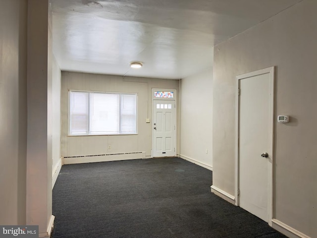 carpeted foyer with a baseboard radiator